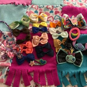 27 piece set bows, hair ties, clips and 1 necklace.